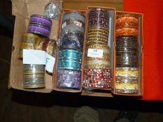 Four Boxes of Assorted Asian and Costume Bangles