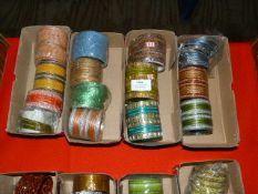 Four Boxes of Assorted Asian and Costume Bangles