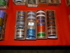 Four Boxes of Assorted Asian and Costume Bangles