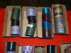 Four Boxes of Assorted Asian and Costume Bangles
