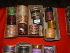 Four Boxes of Assorted Asian and Costume Bangles