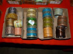 Four Boxes of Assorted Asian and Costume Bangles