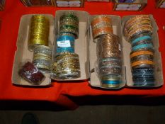 Four Boxes of Assorted Asian and Costume Bangles