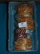 Box Containing 9 Packs of Asian Style Bracelets