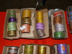 Four Boxes of Assorted Asian and Costume Bangles