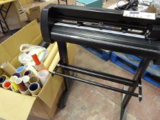 Electric Vinyl Cutter and a Box of Vinyl, Cutting