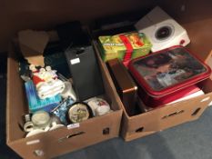 Two Boxes Containing Biscuit Tins, Ornaments, Mugs