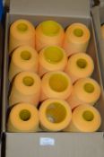 Twelve Cones of Gold Polyester Thread