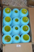 Twelve Cones of Pale Blue Polyester Thread