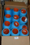 Twelve Cones of Blue Polyester Thread