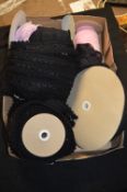 Four Rolls of Black and a Roll of Pink Lace Edging