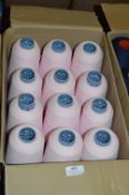 Twelve Cones of Baby Pink Polyester Thread