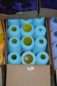 Twelve Cones of Turquoise Polyester Thread