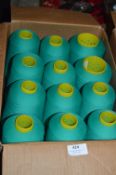 Twelve Cones of Emerald Green Polyester Thread