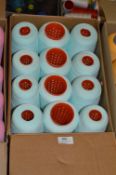 Twelve Cones of Pale Green Polyester Thread