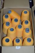 Twelve Cones of Gold Polyester Thread