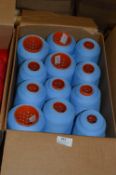 Twelve Cones of Pale Blue Polyester Thread