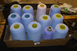 Twelve Cones of Blue, Pink and Lilac Polyester Thread