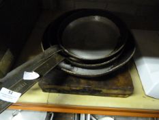 Three Aluminium Saucepans and Two Pizza Stones