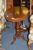 Mahogany Oval Topped Pedestal Tip Table