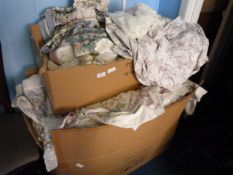 Two Boxes Containing Floral Curtains and Bedding