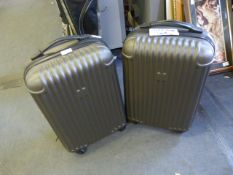 Two Hard Plastic Wheeled Suitcases