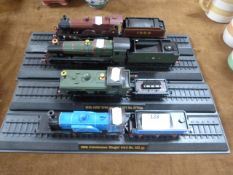 Collection of Four Model Seam Trains on Track