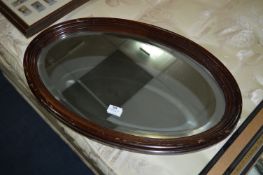 Oval Mahogany Framed Bevelled Edge Wall Mirror