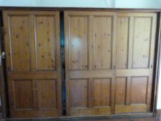 *Large Pine Storage Unit Enclosed by Three Sliding