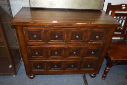 Dark Wood Three Height Chest of Drawers with Patte