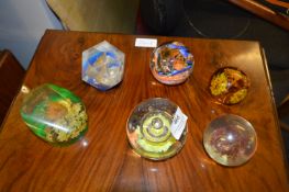 Four Glass and Two Plastic Paperweights