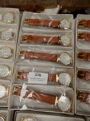 Box Containing 10 Ladies Fashion Watches with Tan