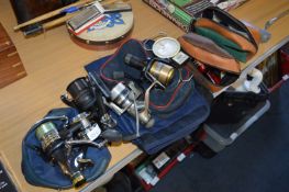 Six Fresh Water Fishing Reels with Bags and a Pair