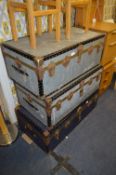 Three Metal Bound Travel Trunks
