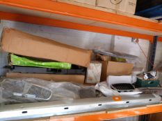 *Shelf of Car Parts Including Ratio Motors, Grills