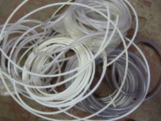 Box Containing Assorted Coils of Plastic Tubing