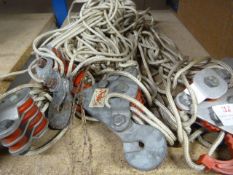 Four Pulleys with Hooks and a Quantity of Cord