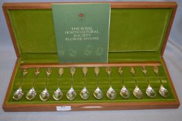 Set of Twelve The Royal Horticultural Society Flower Spoons with Gold Panels