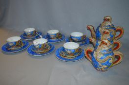 Japanese Kutani Dragon Pattern Twenty One Piece Tea Set with Geisha Girl Bases