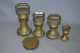 Set of Four Brass Bell Weights and One Other Weight