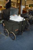 Edwardian Green Wood Bodied Pram with Large Composition Body Doll