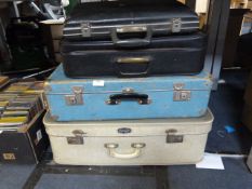 Three Vintage Suitcases and a Briefcase