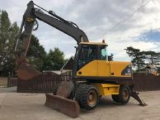 VOLVO EW140 WHEELED EXCAVATOR WITH BLADE AND LEGS