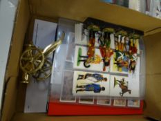 Four Napoleonic soldiers, model brass cannon, Napoleonic uniform cigarette cards etc