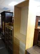 An IKEA Billy beech wood tall narrow bookcase