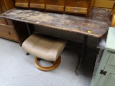 A vintage Ercol dark wood refectory-style dining table (distressed) together with a modern tan