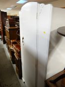 A vintage Lebus single door wardrobe having been painted white