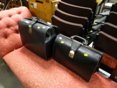 A vintage large black document carrying case together with smaller black briefcase