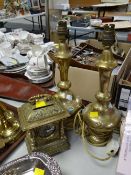 A pair of brass relief & semi-precious stone decorated electric table lamps together with a brass