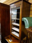 An Edwardian mahogany & inlaid glass door music cabinet